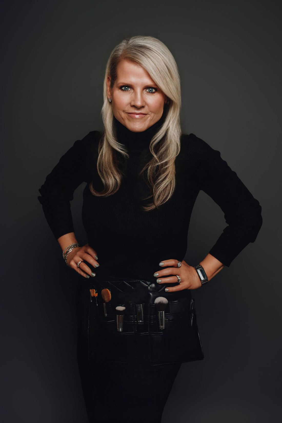 Kim Steele, makeup brushes at her belt