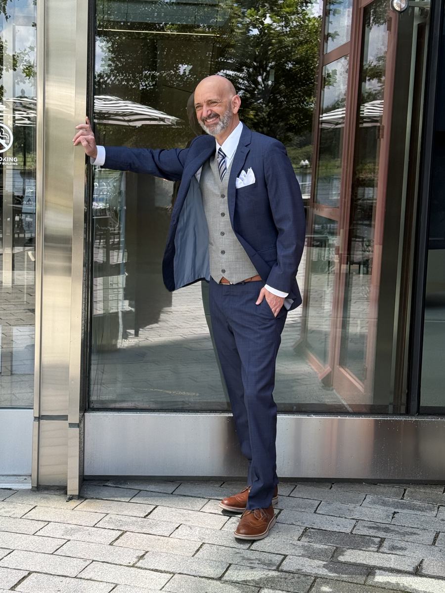 Client in styled three-piece suit — wardrobe styling by Kim Steele