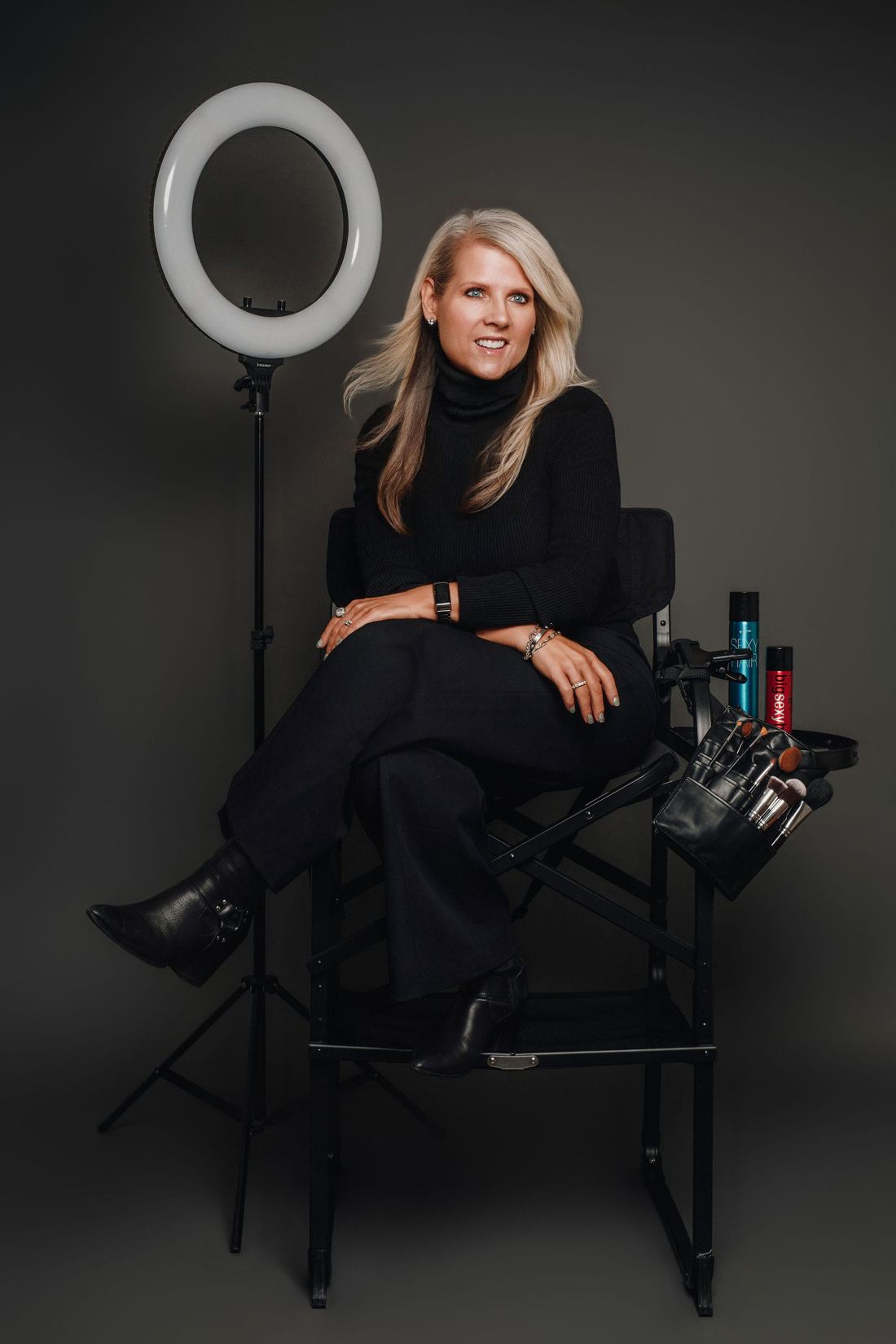 Kim Steele in her makeup chair, ring light and kit at her side